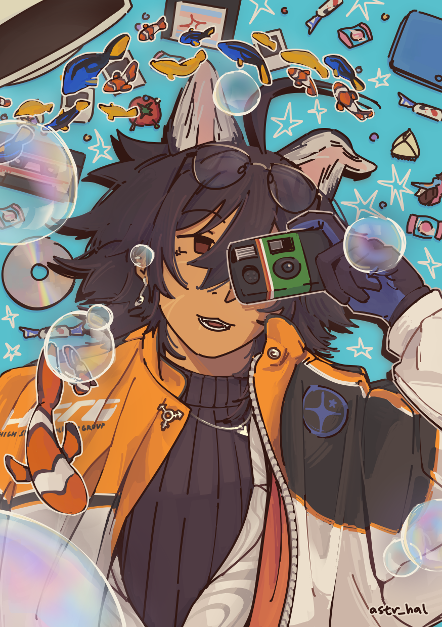 Ethan lying down, disposable camera over one eye. He lies down next to various trinkets, surrounded by bubbles and fish.